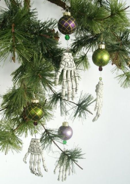 skeleton hands paired with more traditional Christmas ornaments will give an ultimate look to your Halloween tree