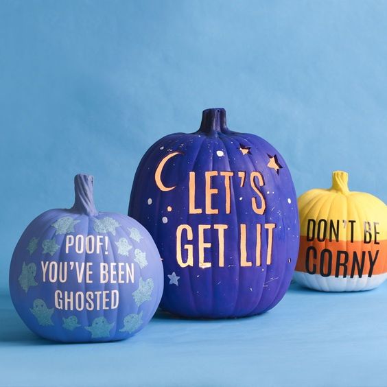 modern colorful Hallowene pumpkins in lilac, purple and orange, with drilled letters, stenciled ones and some letters