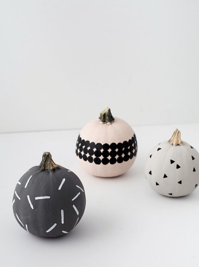 modern patterned pumpkins made using paints, stencils and stickers look nice and cool and will be a great idea for modern Halloween