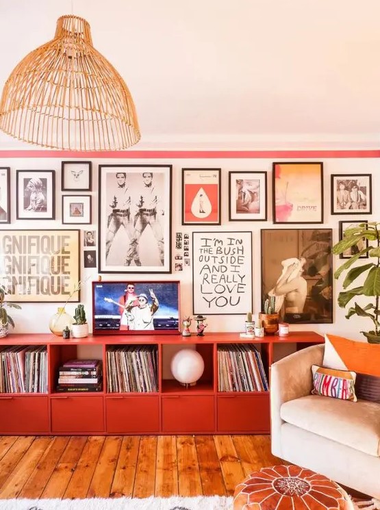 a bold gallery wall with colorful art in mismatching black frames will bring a touch of color and an artful feel