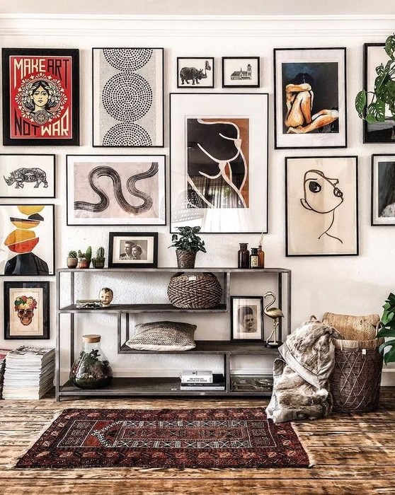 a statement gallery wall with thin black frames and black and white matting built around a central piece