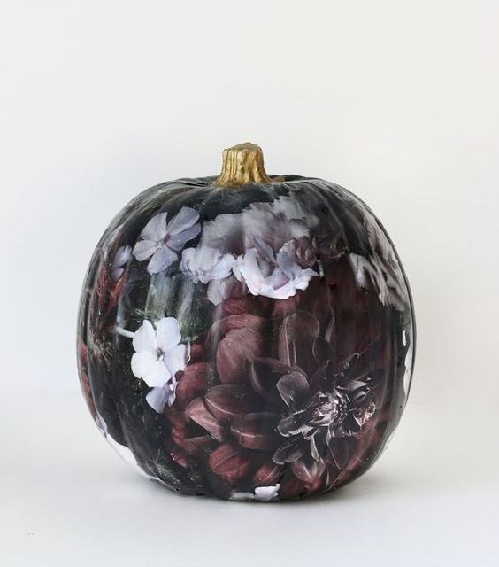 a gorgeous black and haunted flower pumpkin painted is a fantastic idea for refined Halloween decor