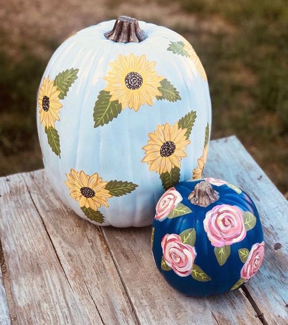 light blue and navy pumpkins with bold painted blooms are amazing for your fall decor, both indoor and outdoor