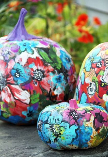 super bold and colorful floral pumpkins like these ones will be a nice idea for a colorful Halloween party or just an bright eclectic space