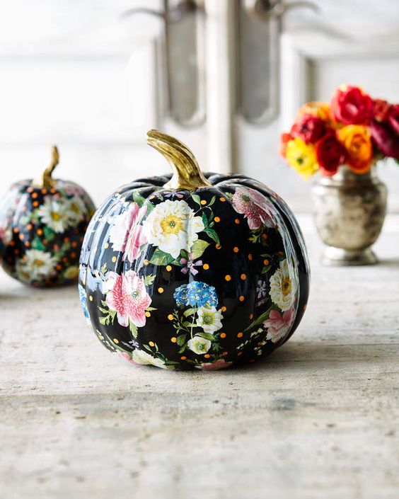 a cool black Halloween pumpkin with bright and white blooms decoupaged and a gilded stem is a fantastic idea for Halloween