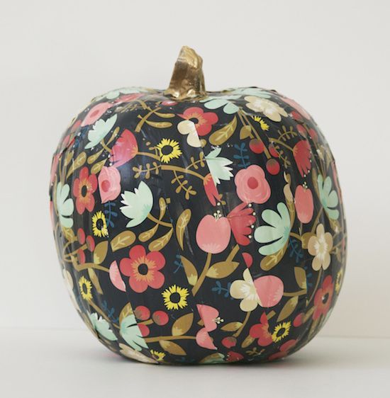 a pumpkin decorated with black floral stripes to make your Halloween ultimate without spending much time