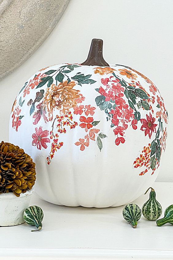 a white pumpkin decorated with torn tissues is a catchy and lovely idea to style your space for fall or Thanksgiving