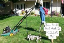 27 a Halloween outdoor space with a skeleton on the grass plus a skeleton dog is a cool and fun idea for this holiday