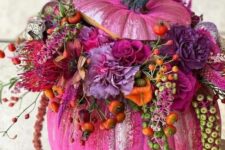 29 a gorgeous hot pink pumpkin with hot pink, fuchsia, red, violet blooms, orange berries and foliage for bold fall decor