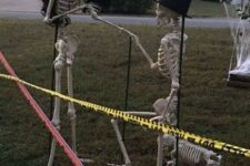 36 a romantic Halloween scene with skeletons proposing and some skeleton dogs is a very cool and lovely idea to rock