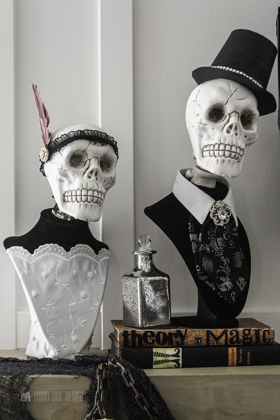 elegant and scary Halloween scull busts dressed up as a woman and a man are great for vintage Halloween decor