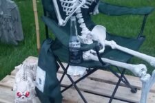 38 a simple and fun Halloween fishing scene with a skeleton and skeleton dog, with beer bottles