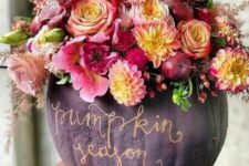 40 a sophisticated matte purple pumpkin done with pink, neutral, yellow blooms, berries and apples and gold calligraphy