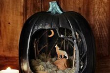 a lovely Halloween diorama in black, with moss, rocks, branches and a wolf and a moon is a gorgeous idea to make a statement