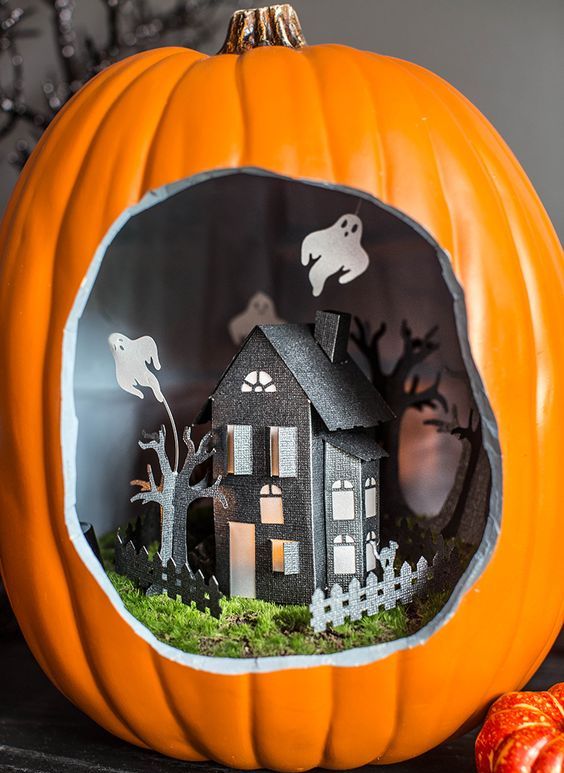a lovely Halloween diorama with a black paper house with trees and a fence, moss and ghosts is a gorgeous idea to try