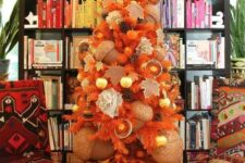 03 a beautiful fall tree in orange, with pinecones, citrus, oversized acorns and ornaments is very unusual