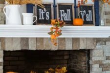 07 a bright and simple Thanksgiving mantel with wheat in a jug, chalkboard signs, window frames, bold pumpkins and fruits