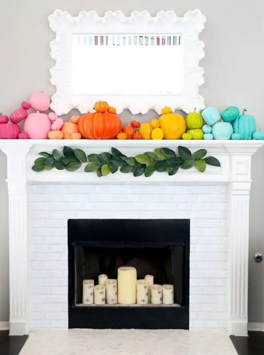 a super colorful rianbow pumpkins make the mantel look like fall and bring intense colors to the space