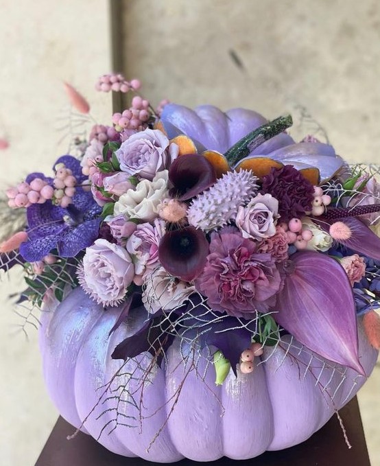 a lilac pumpkin with lilac, mauve, deep purple blooms, greenery and berries will be a great Thanksgiving centerpiece