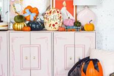 11 bold and beautiful fall pumpkins with painted blooms and leave,s in bold colors and with bows are amazing