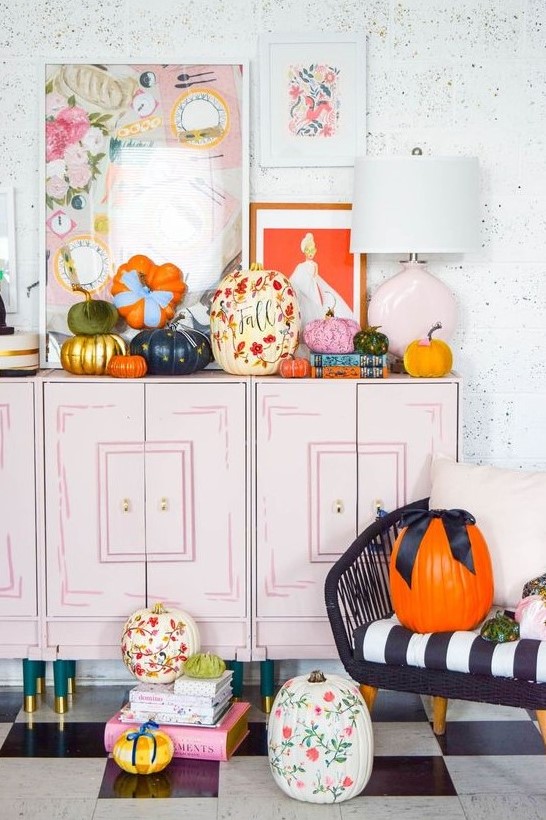 bold and beautiful fall pumpkins with painted blooms and leave,s in bold colors and with bows are amazing