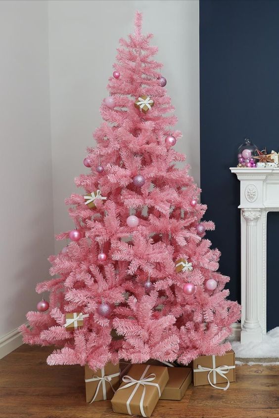 a pink Christmas tree decorated with pink and mauve ornaments and little gift boxes is a lovely idea