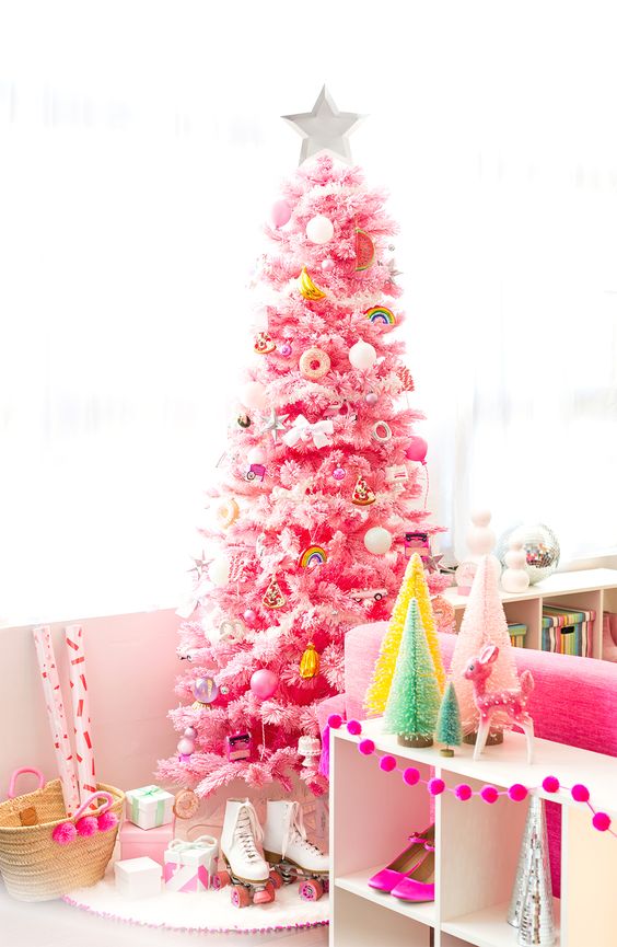 a pink Christmas tree decorated with various bold ornaments food-themed and many others is a fun and cool idea