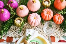 27 a colorful and glam Thanksgiving tablescape with a greenery and macrame runner, white gold rimmed plates, colorful pumpkins