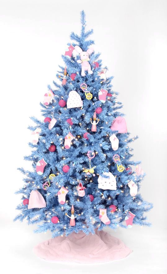 a blue Christmas tree decorated with socks, beanie, little plush toys and red and yellow ornaments