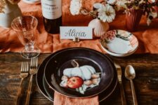 30 a pretty rust-colored Thanksgiving tablescape with rust linens and vases, dried and fresh blooms, painted black plates