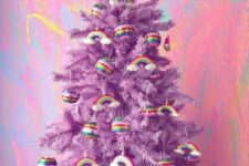 40 a purple Christmas tree decorated with rainbows and rainbow baubles is a lovely and super bold idea
