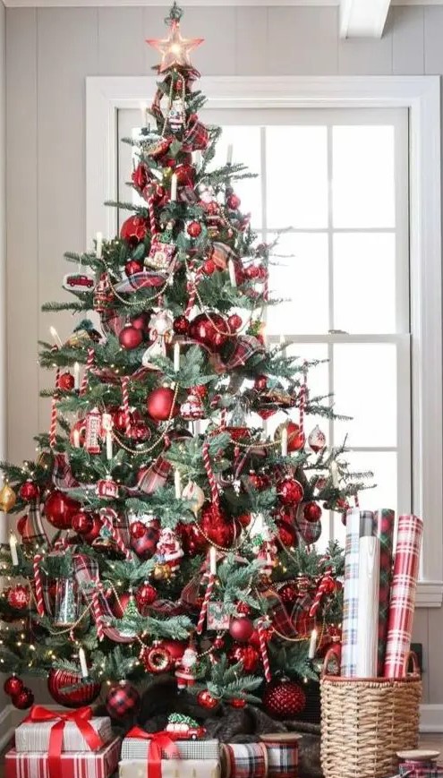 a vintage-inspired Christmas tree with red ornaments, lights and candy candes looks bold and catchy
