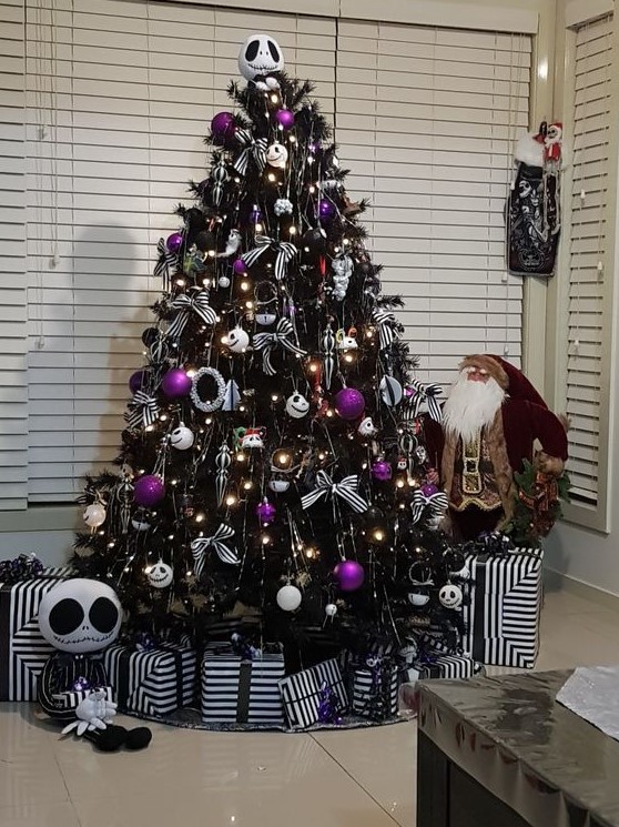 40 Refined Purple Christmas Decor Ideas DigsDigs A Nightmare Before Christmas Tree In Black With White And Purple Ornaments Striped Bows And Wreaths And Jack Skellington Decor