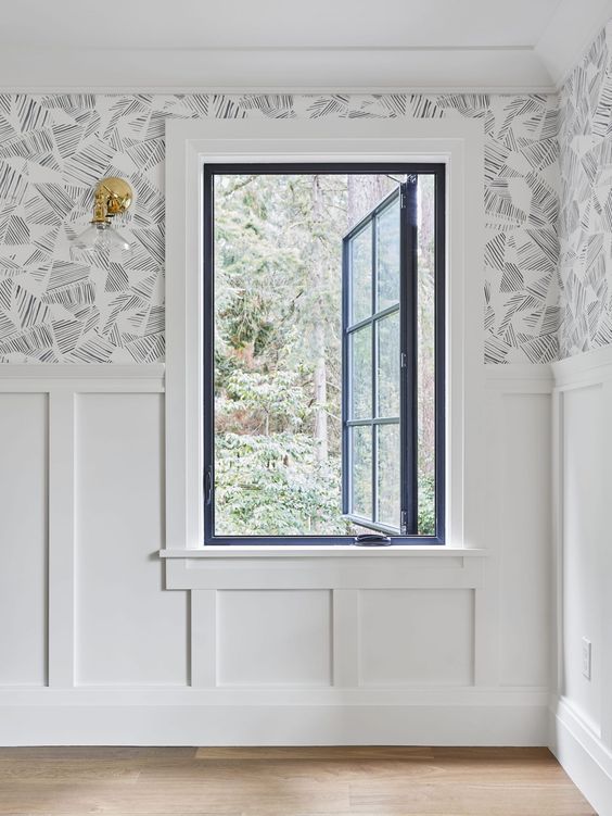 a chic navy frame casement window with French-style panes is a stylish idea for the space and it looks contrasting