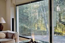 a fireplace centerpiece is a cool solution for an open space
