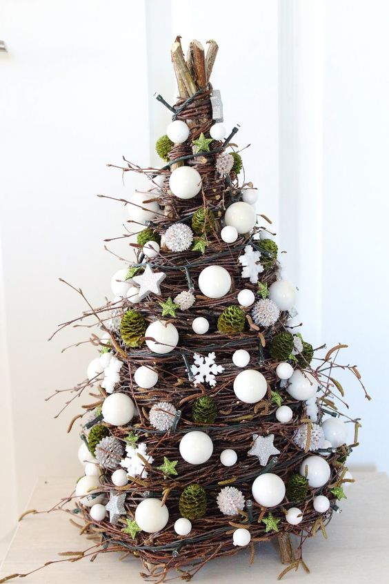 a cone-shaped Christmas tree made of twigs, vine, moss, white beads, stars and pearls is an amazing idea for the holidays