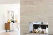 a gorgeous double-sided fireplace, which gives coziness to both the living room and dining space