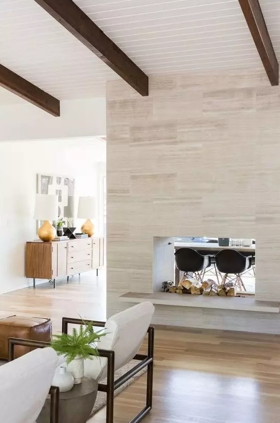 a gorgeous double-sided fireplace, which gives coziness to both the living room and dining space