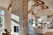 a grey brick double-sided fireplace will give a cozy rustic feel to the space and will make it welcoming and warming up