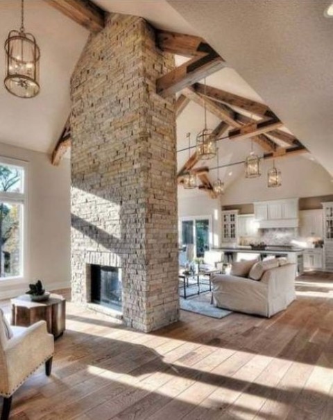 a grey brick double-sided fireplace will give a cozy rustic feel to the space and will make it welcoming and warming up