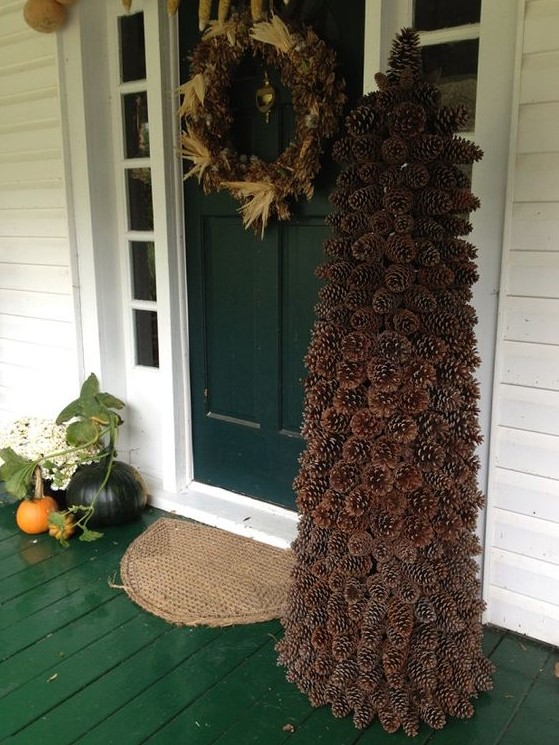 a large pinecone Christmas tree looks maximally natural and makes the porch cooler and fresher