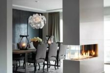 a sleek white minimalist double-sided fireplace will give a chic look to the space and make it cozy
