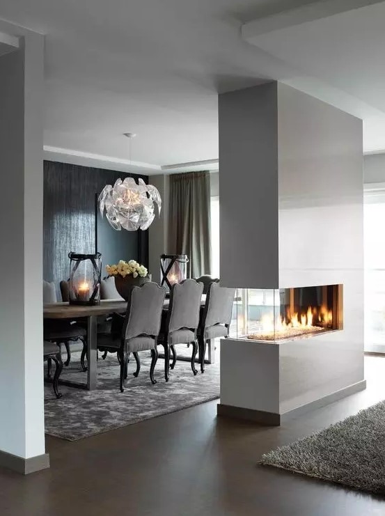 a sleek white minimalist double-sided fireplace will give a chic look to the space and make it cozy