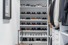 a small and narrow walk-in closet with open shelving and storage compartments, drawers and an artwork is a great space
