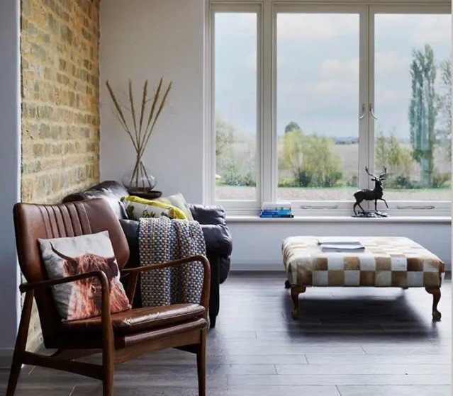 a stylish modern space with a large casement window that provides and a lot of natural light and cool views is amazing