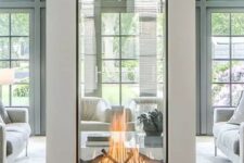 a two sided fireplace with glass will provide two spaces with a beautiful fire look and with coziness and chic