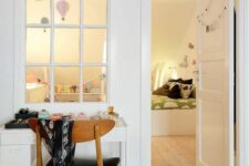 a window that connects two rooms allows naturla light to the kids’ space and makes it more welcoming and cozy