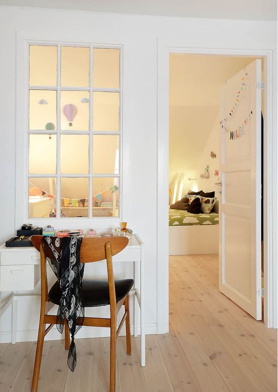 a window that connects two rooms allows naturla light to the kids' space and makes it more welcoming and cozy