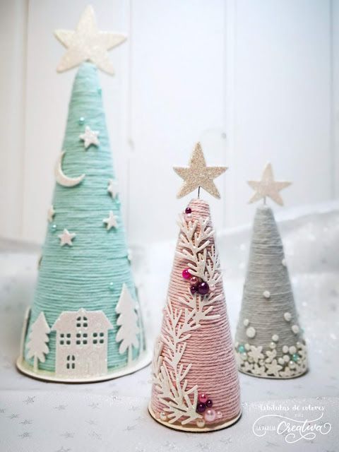 grey, pink and green yarn cones with arrangements made of felt, beads, applique and topped with little stars