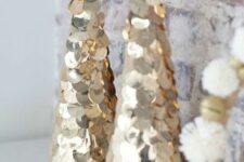 large gold sequin cone-shaped Christmas trees are great to decorate your space for winter holidays glam style
